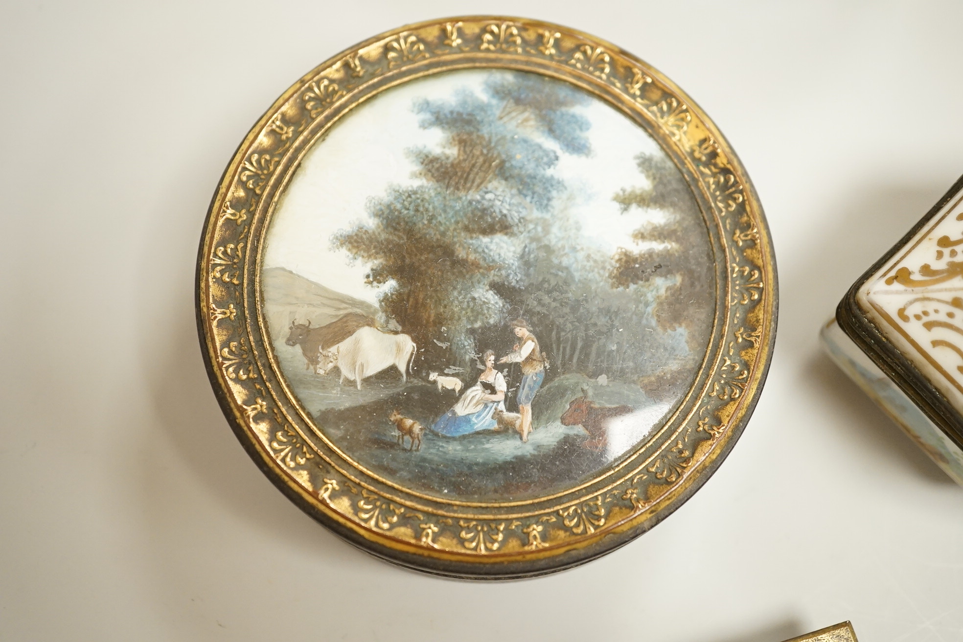 A collection of 19th century and later snuff and pill boxes, a silhouette frame and a gilt metal frame